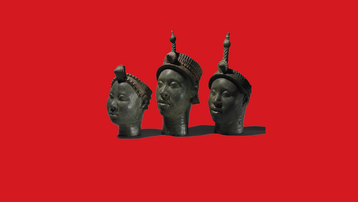 Three Benin Bronzes on a red background