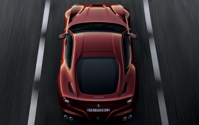 Ferrari F12 Berlinetta driving on a road