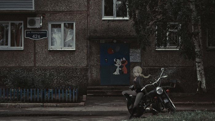 Anime girl on a motorcycle in front of a building