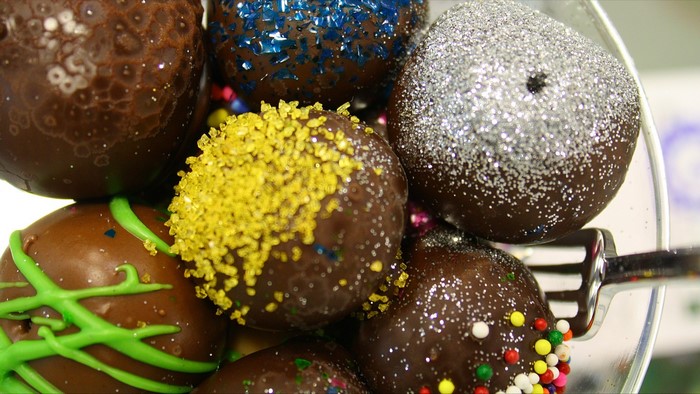 Chocolate truffles with colorful sprinkles and glitter