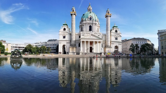 Karlskirche church reflection in water, Vienna, Austria
