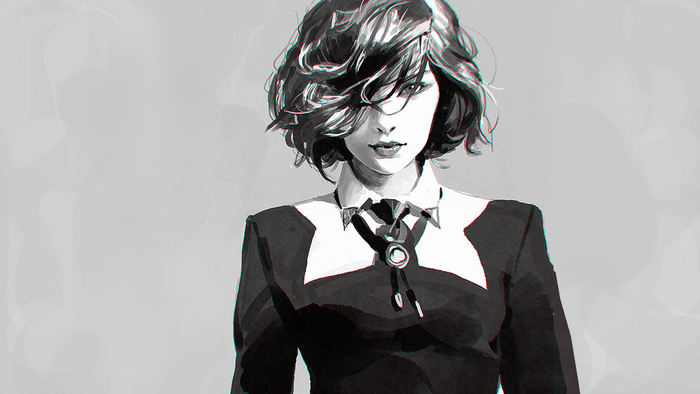 Woman in a black suit with a bolo tie