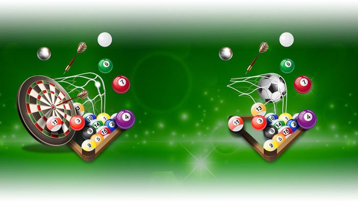 Billiard balls, darts, and soccer ball on green background