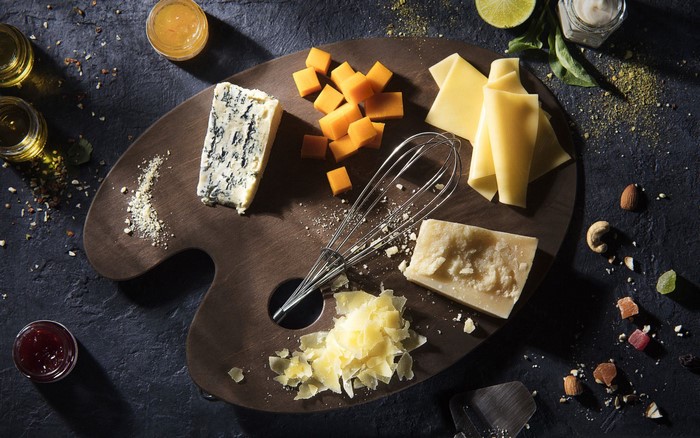 Cheese platter on a wooden palette board