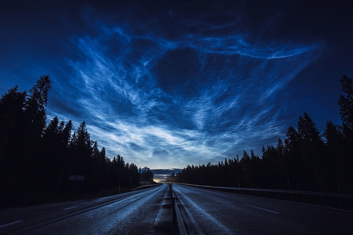 Noctilucent clouds over a highway in Sweden