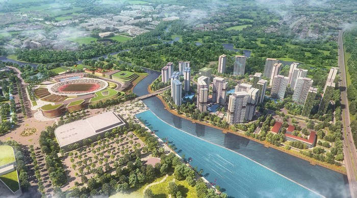 Aerial view of a modern cityscape with a stadium and river