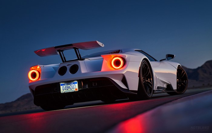 White Ford GT Mk II with spoiler on road