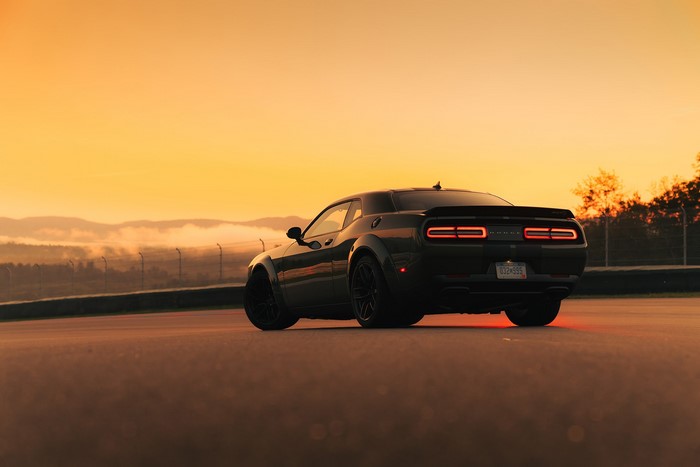 Dodge Challenger SRT on a race track at sunset