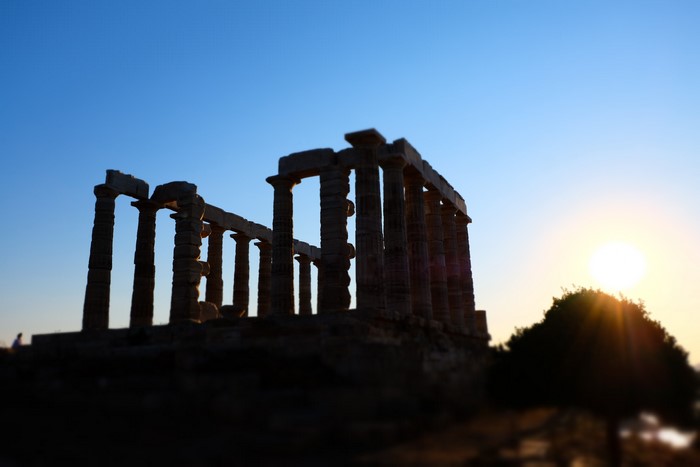 Temple of Poseidon in Greece at sunset