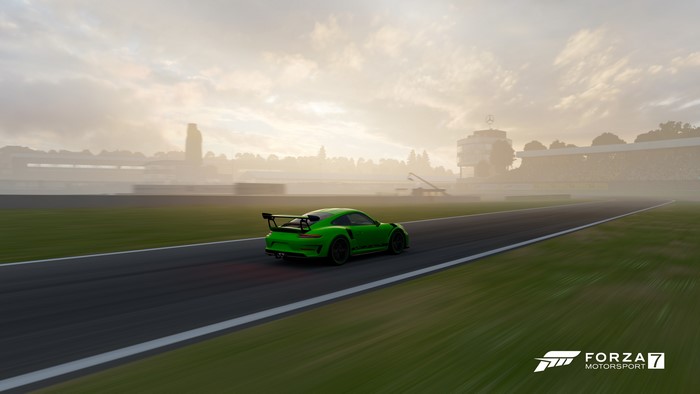 Green Porsche 911 GT3 RS on a race track in Forza Motorsport 7