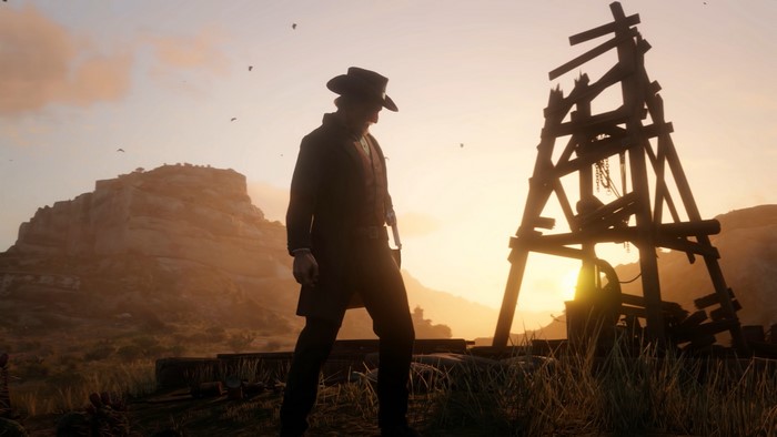 Man in cowboy hat near mining rig in Red Dead Redemption 2