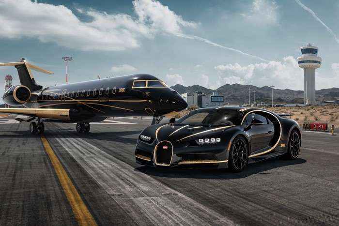 Bugatti Chiron and private jet on tarmac
