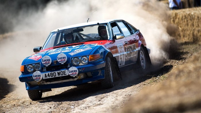 Rover rally car racing on a dirt track
