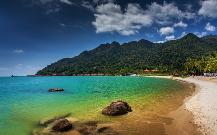 Tropical beach with mountains and turquoise water