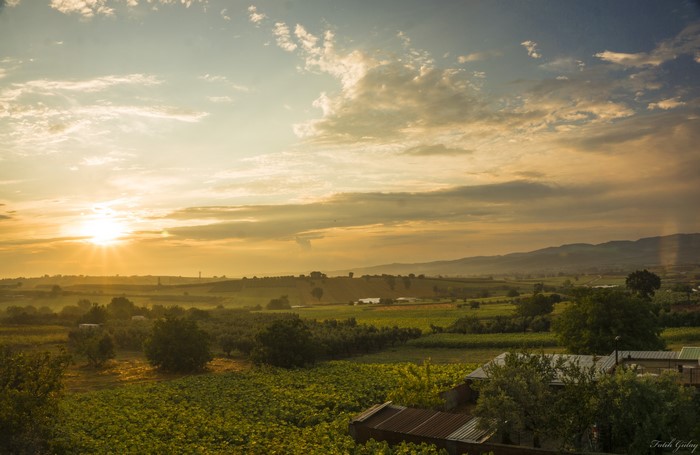 Sunset over a rural landscape with farms and fields