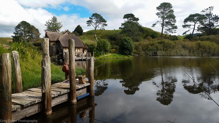 Hobbiton The Lord of the Rings lake with pier and fishing rods
