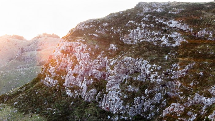 4K sunset lens flare over rocky New Zealand landscape