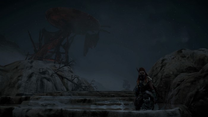 Aloy from Horizon: Zero Dawn in a desolate landscape