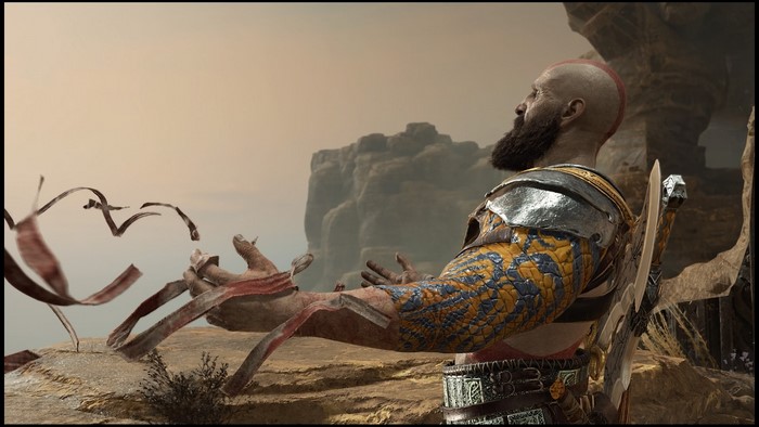 Kratos from God of War with ribbons in the desert