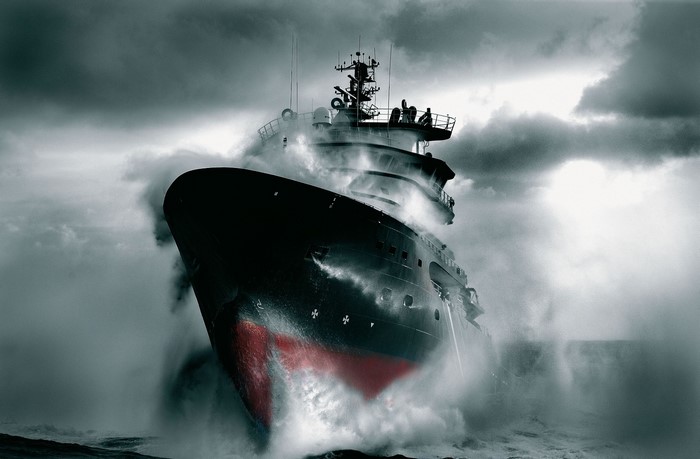 Ship sailing through stormy seas