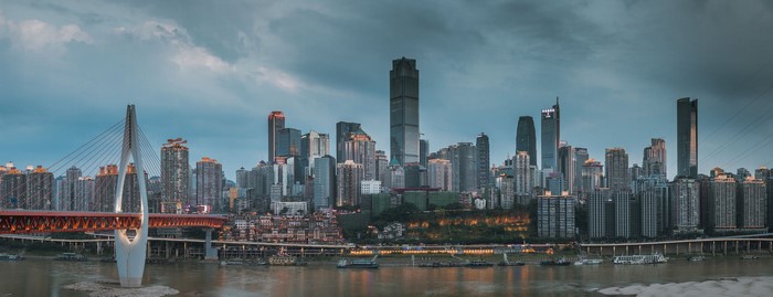 Chongqing city skyline and bridge over river