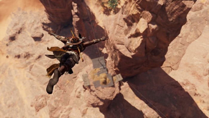 Bayek from Assassin's Creed Origins jumping off a cliff