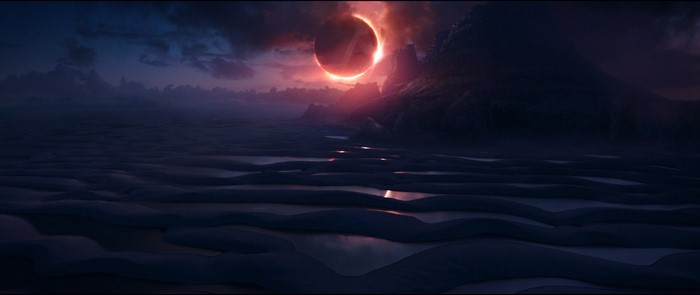 Solar eclipse over a rocky planet landscape