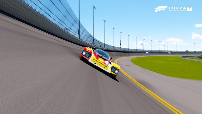 Porsche race car on a banked turn in Forza Motorsport 7
