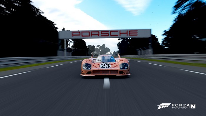 Porsche race car with number 23 on a track