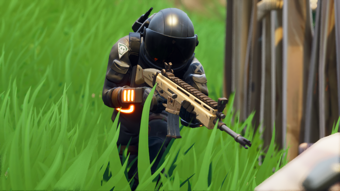 Fortnite character in tactical gear holding a rifle
