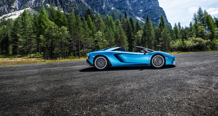 Blue Lamborghini Aventador SVJ Roadster in mountains