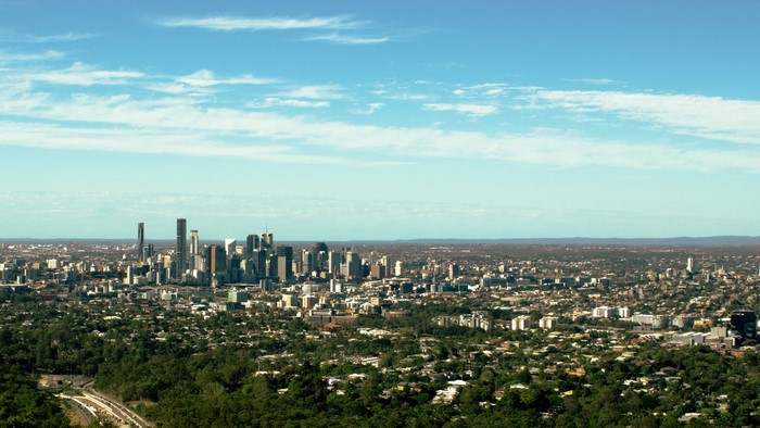 Brisbane skyline with trees and blue sky
