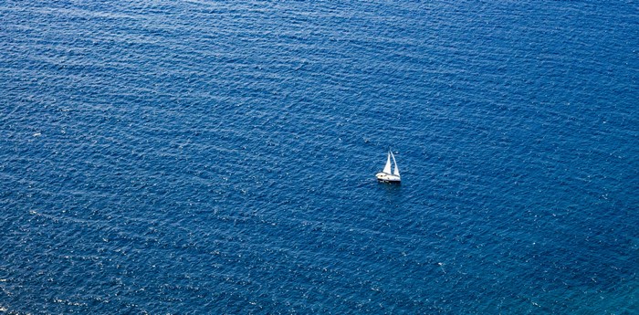 Sailboat on a windy blue sea