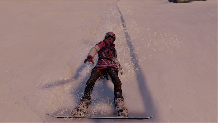 Snowboarder in pink and black outfit on a snowy slope