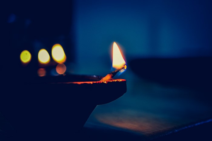 Burning diya with bokeh lights