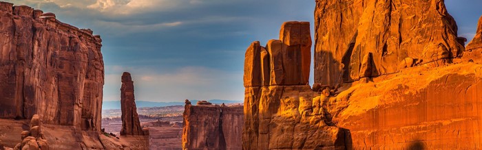 Desert canyon with rock formations under a clear sky