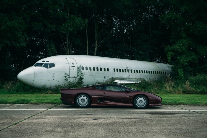 Jaguar XJ220S and abandoned Boeing 737 in forest