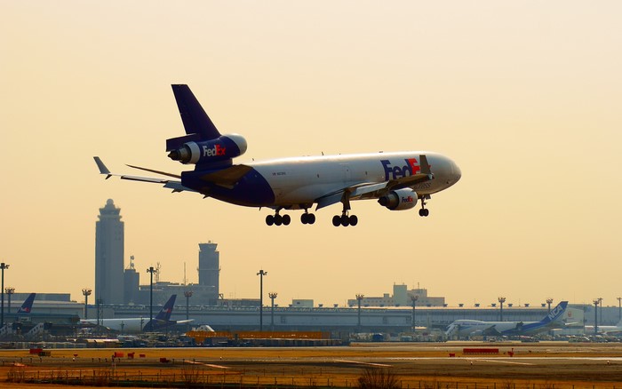 FedEx MD-11 cargo plane landing at airport