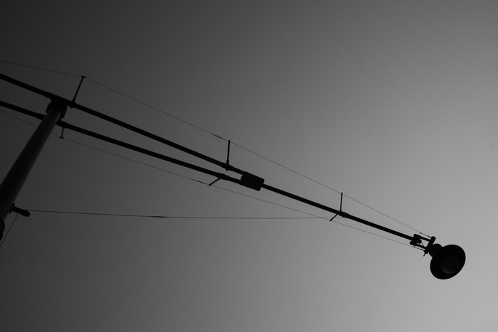 Street light pole with wires and lamp