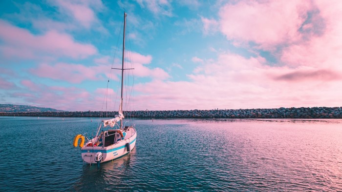 Sailboat on the water at sunset