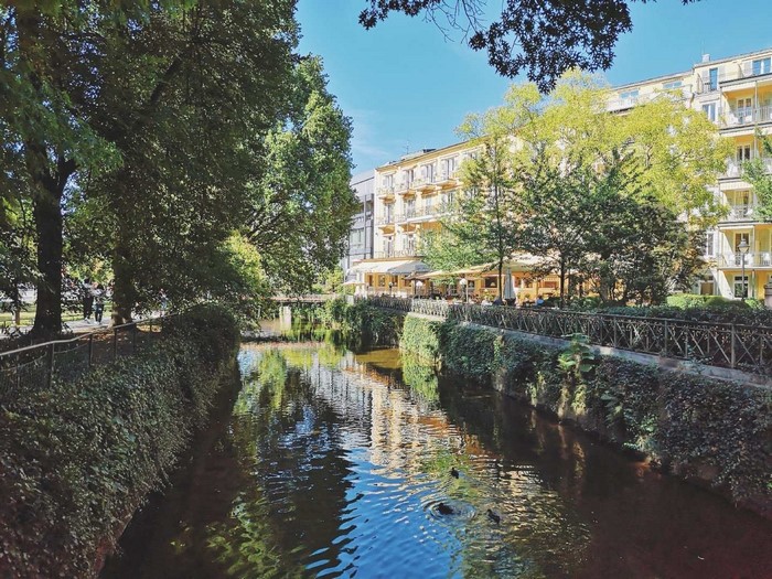 City canal with trees and buildings in Germany