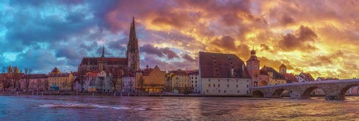 4K Regensburg cityscape with dramatic sky over river