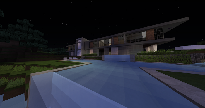 Modern Minecraft mansion with a swimming pool at night