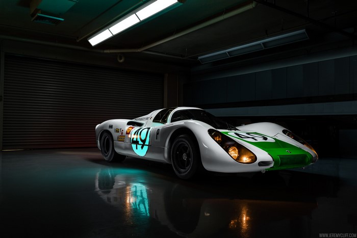 White and green Porsche race car with number 49