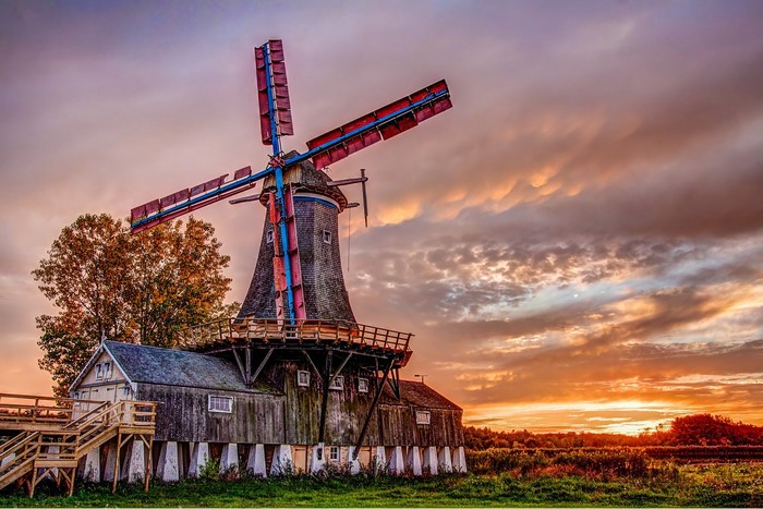 Windmill at sunset with dramatic clouds