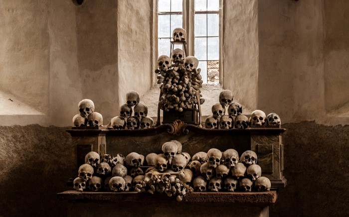 Skulls and bones arranged on an altar in a church