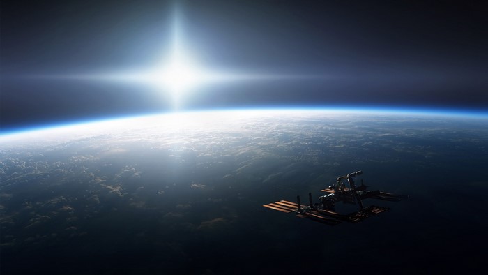 Space station orbiting Earth with bright sun