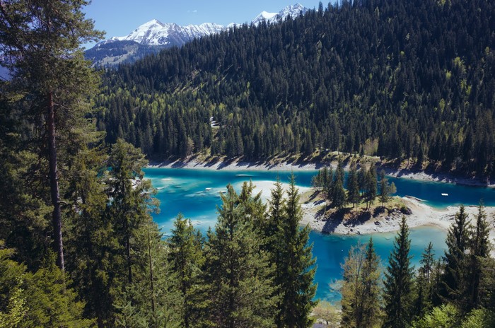 4K Caumasee lake with forest and mountains