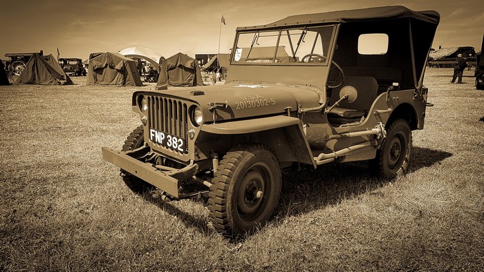 Sepia toned military jeep with USA markings