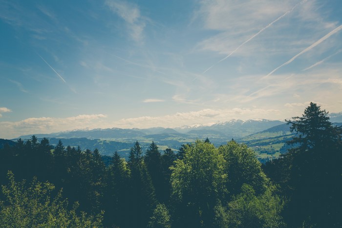 Landscape with Mountains and Contrails